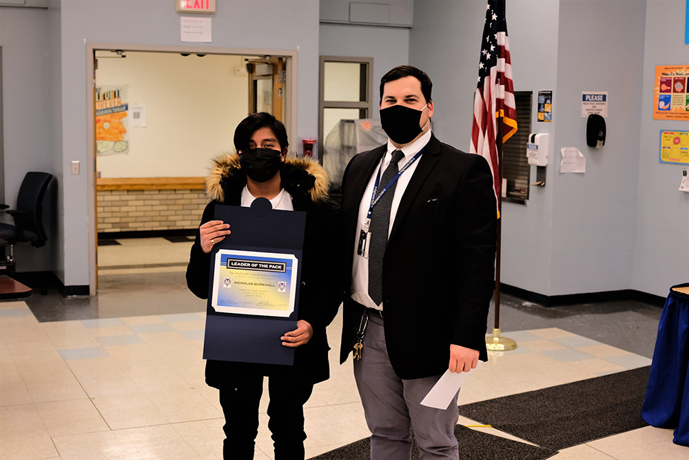 Highland Middle School Asst. Principal Andrew Carnright honored Nicholas Quirk-Hall as the January Leader of the Pack at the Middle School.